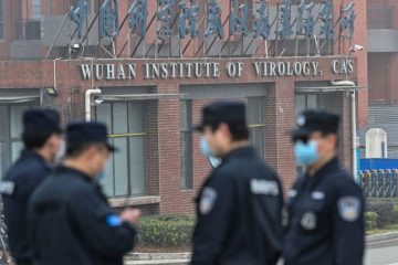 Security guards outside the Wuhan Institute of Virology in Wuhan, China, on Feb. 3. (Thomas Peter/Reuters)